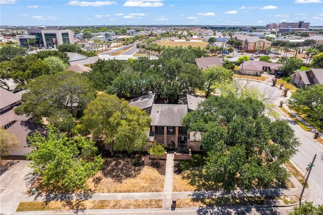 an aerial view of a residential houses and city street