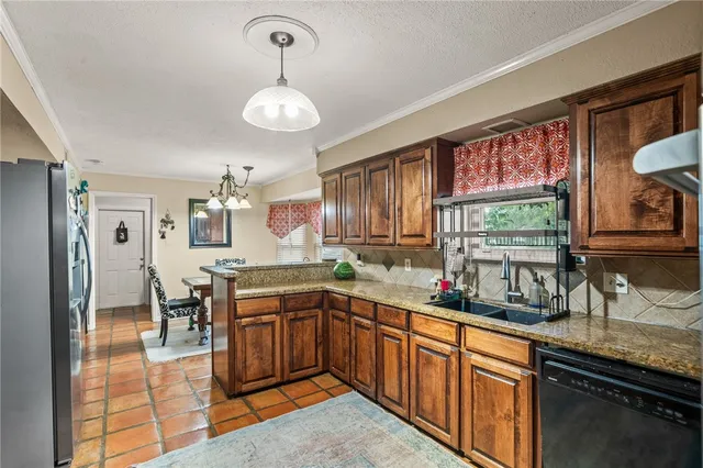 a kitchen with lots of counter space and a sink