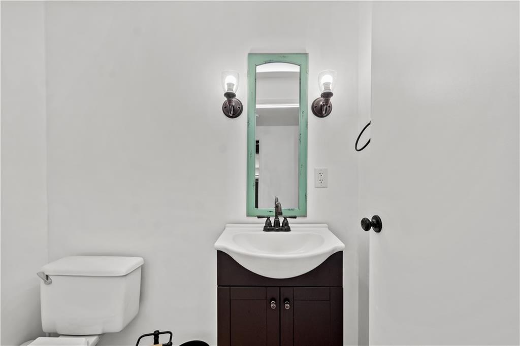 226 Briar Path Imperial, PA 15126 - Photo 23 of 33 a bathroom with a sink a toilet and mirror