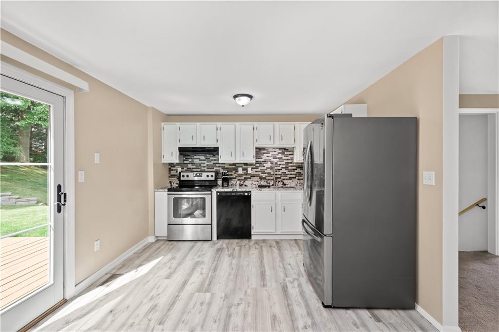 226 Briar Path Imperial, PA 15126 - Photo 8 of 33 a kitchen with a refrigerator and a stove top oven