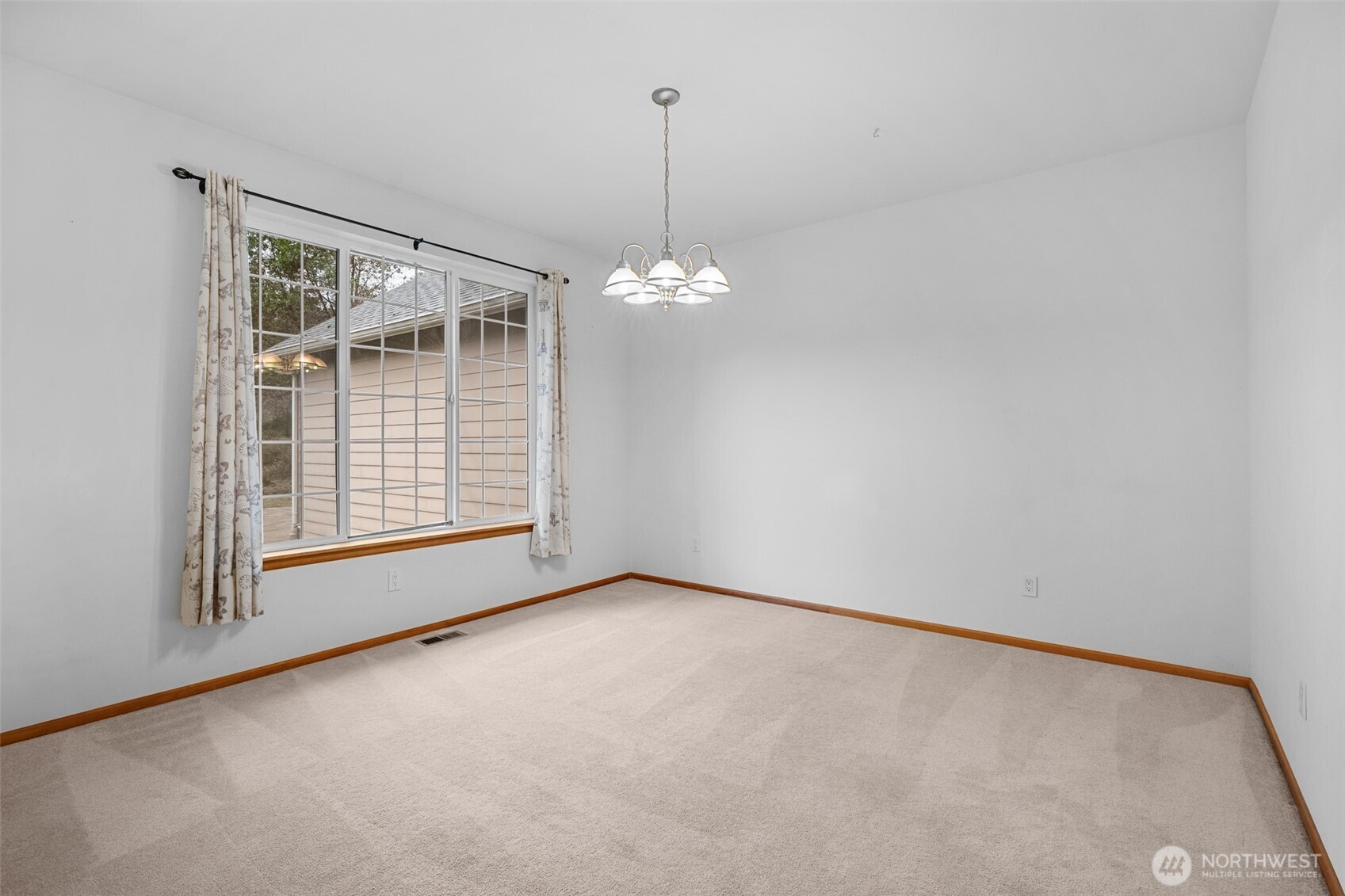 2311 202nd Avenue Southwest Lakebay, WA 98349 - Photo 17 of 39 a view of a room with windows and ceiling fan