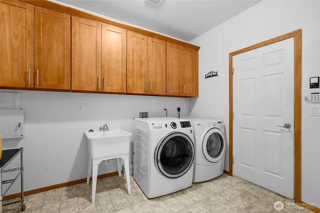 a view of storage and utility room with a window