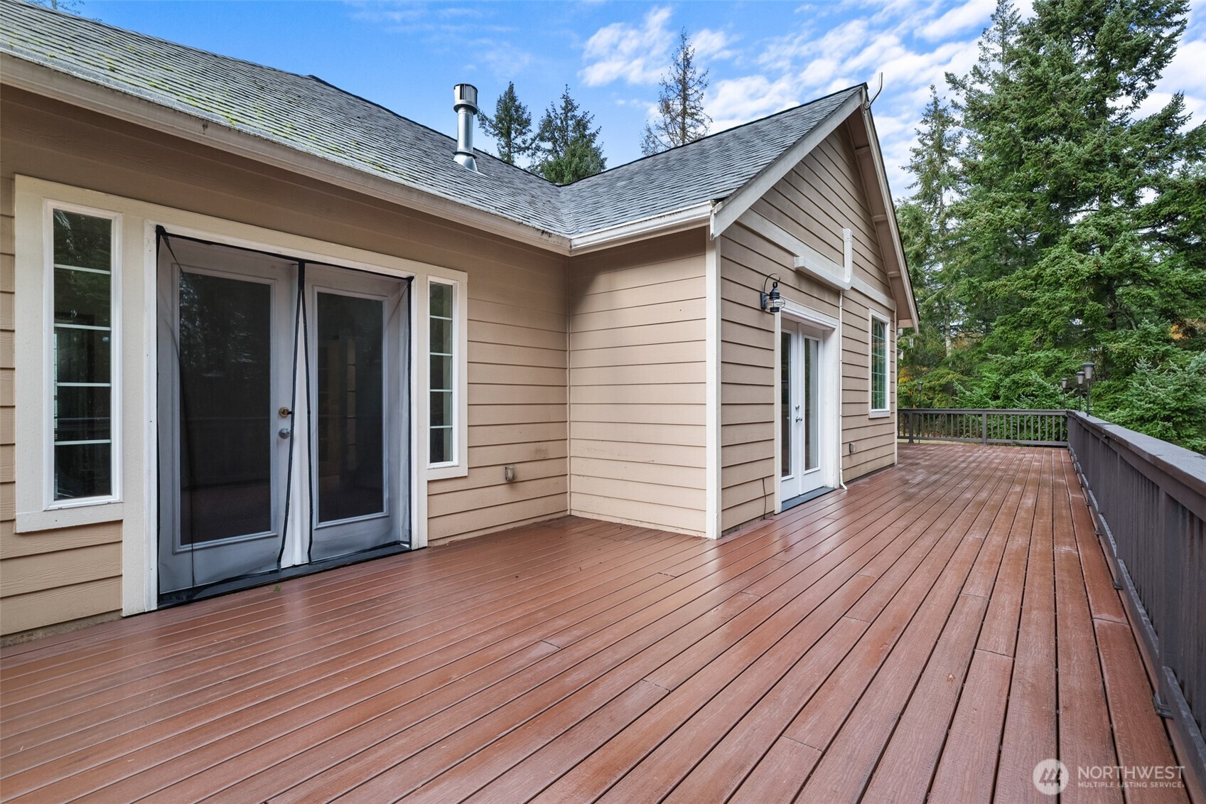 2311 202nd Avenue Southwest Lakebay, WA 98349 - Photo 30 of 39 a view of a house with wooden deck
