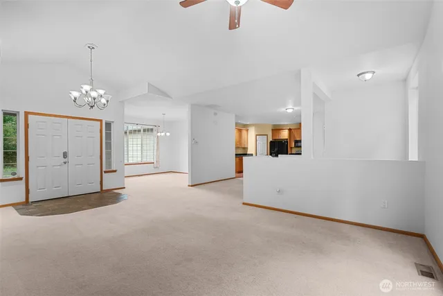 a view of a livingroom with furniture and chandelier