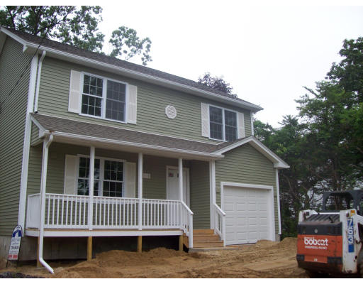 230 Draper Street Springfield, MA 01108 - Photo 1 of 2 a front view of a house with a yard