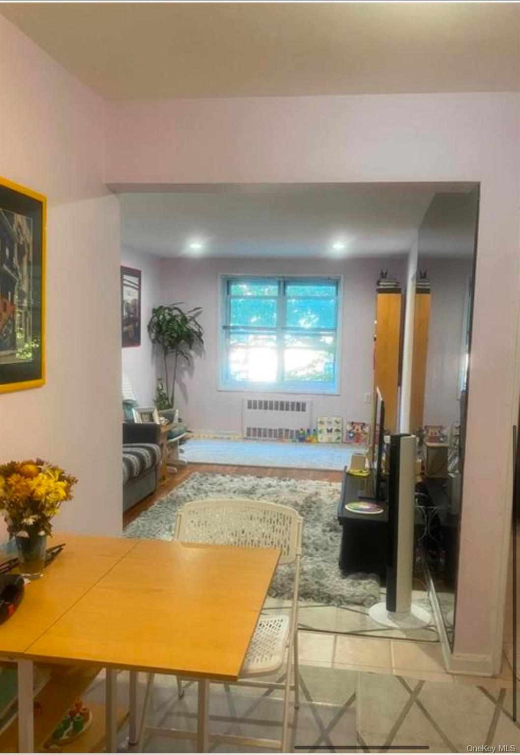 34-10 75th Street, Unit 3L Queens, NY 11372 - Photo 4 of 18 Living area with radiator