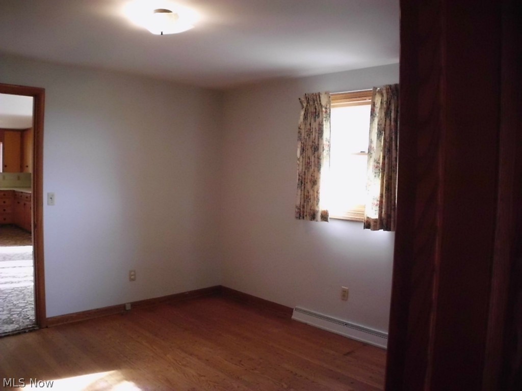 488 West Sunset Drive Rittman, OH 44270 - Photo 9 of 11 Bedroom 3 has 2 large double closets and hardwood floor