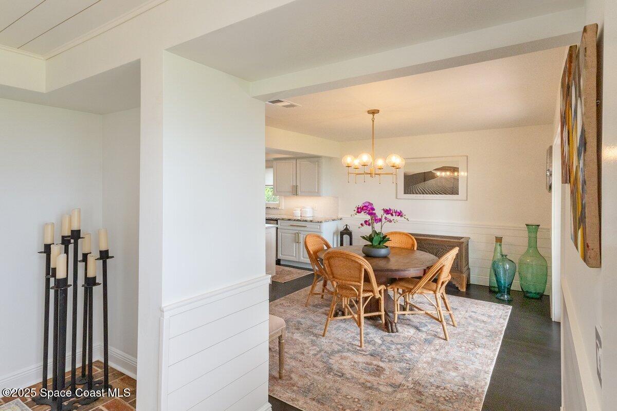 1307 Rockledge Drive Rockledge, FL 32955 - Photo 19 of 75 a view of a dining room with furniture and a chandelier