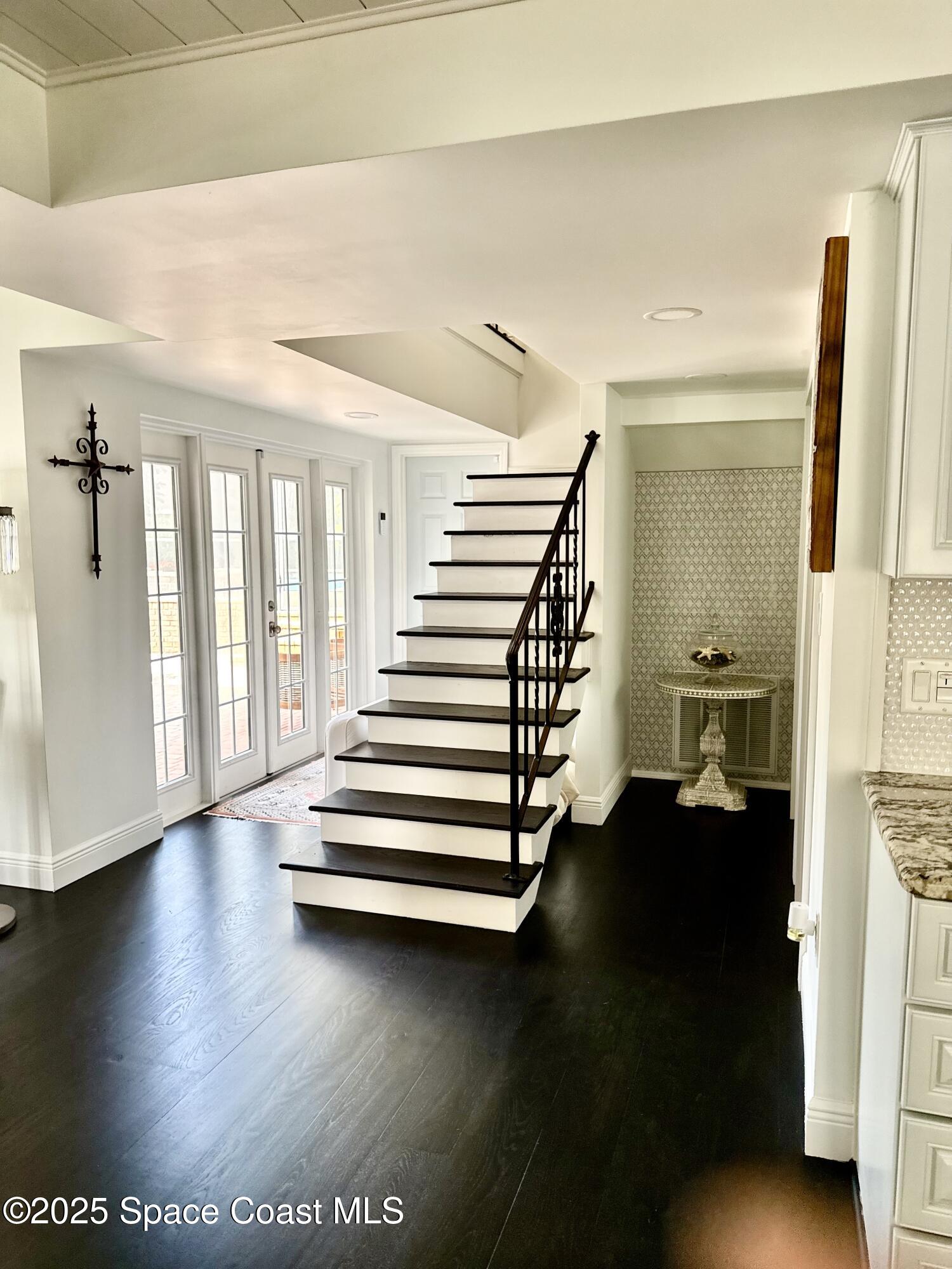 1307 Rockledge Drive Rockledge, FL 32955 - Photo 29 of 75 a view of entryway and hall with wooden floor