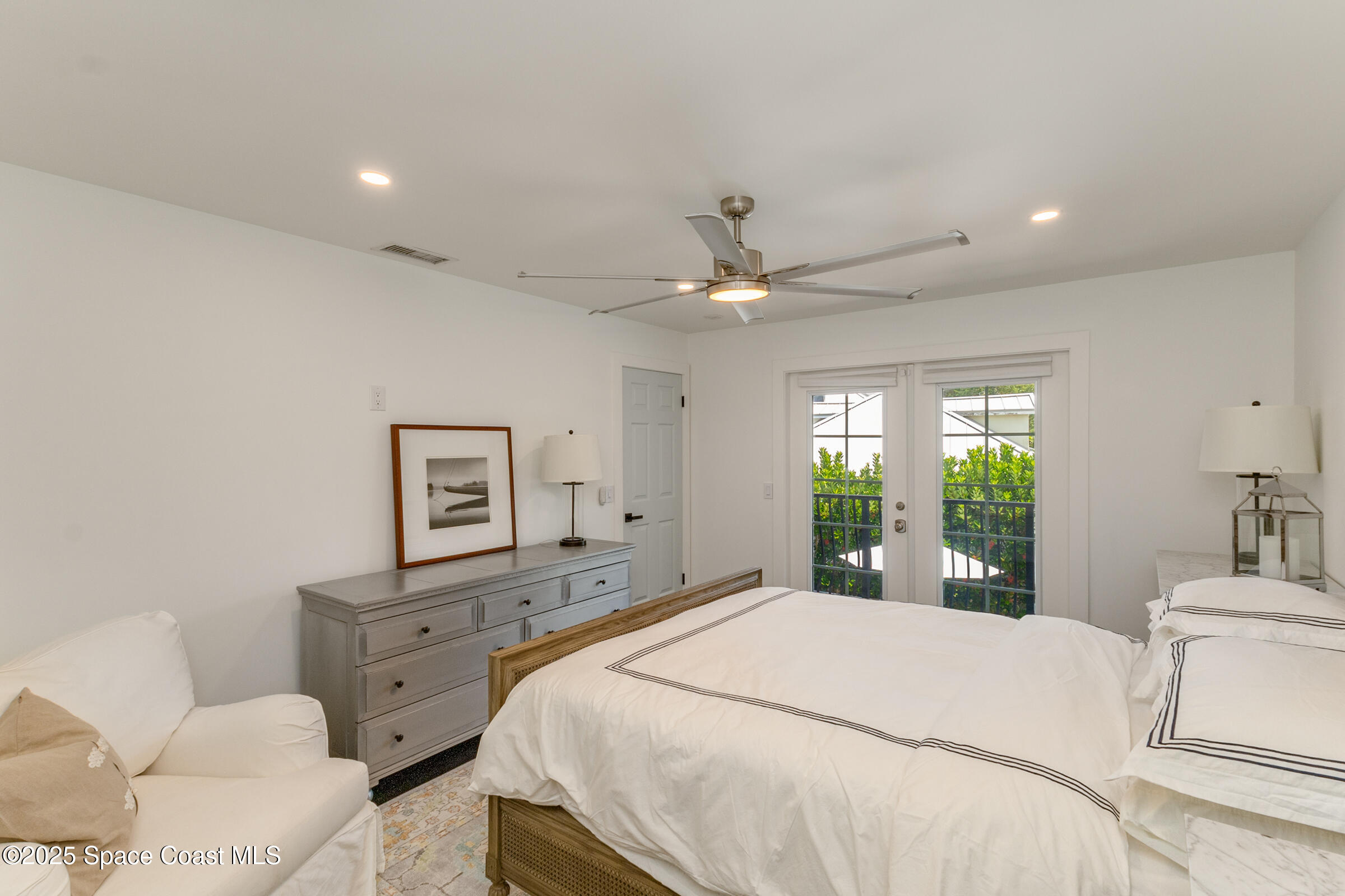 1307 Rockledge Drive Rockledge, FL 32955 - Photo 40 of 75 a bedroom with a bed and a chandelier