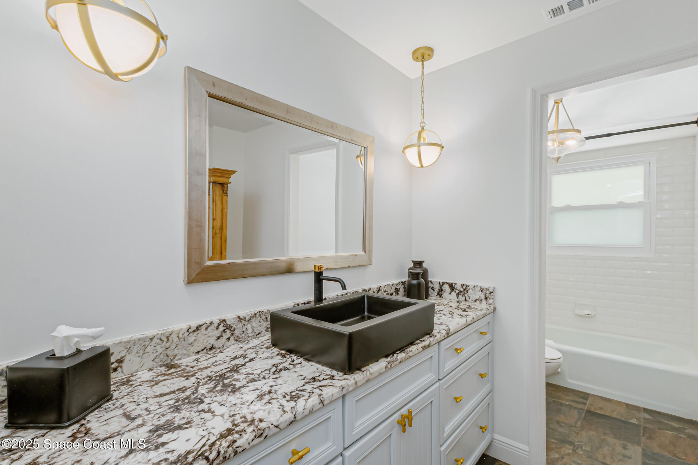 1307 Rockledge Drive Rockledge, FL 32955 - Photo 44 of 75 a bedroom with a bed and a mirror