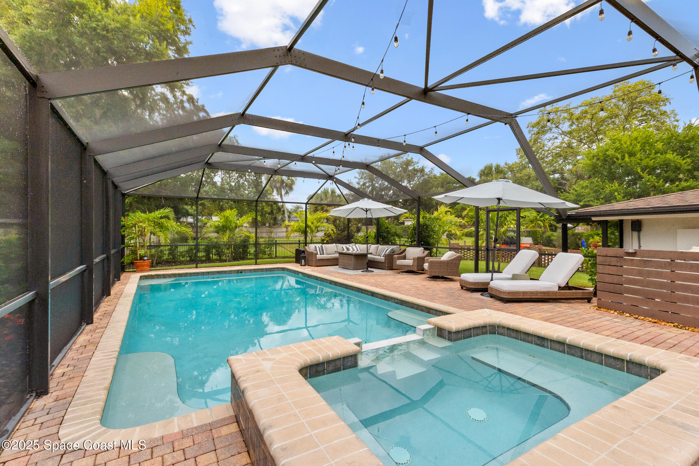 1307 Rockledge Drive Rockledge, FL 32955 - Photo 53 of 75 a view of a swimming pool with a patio