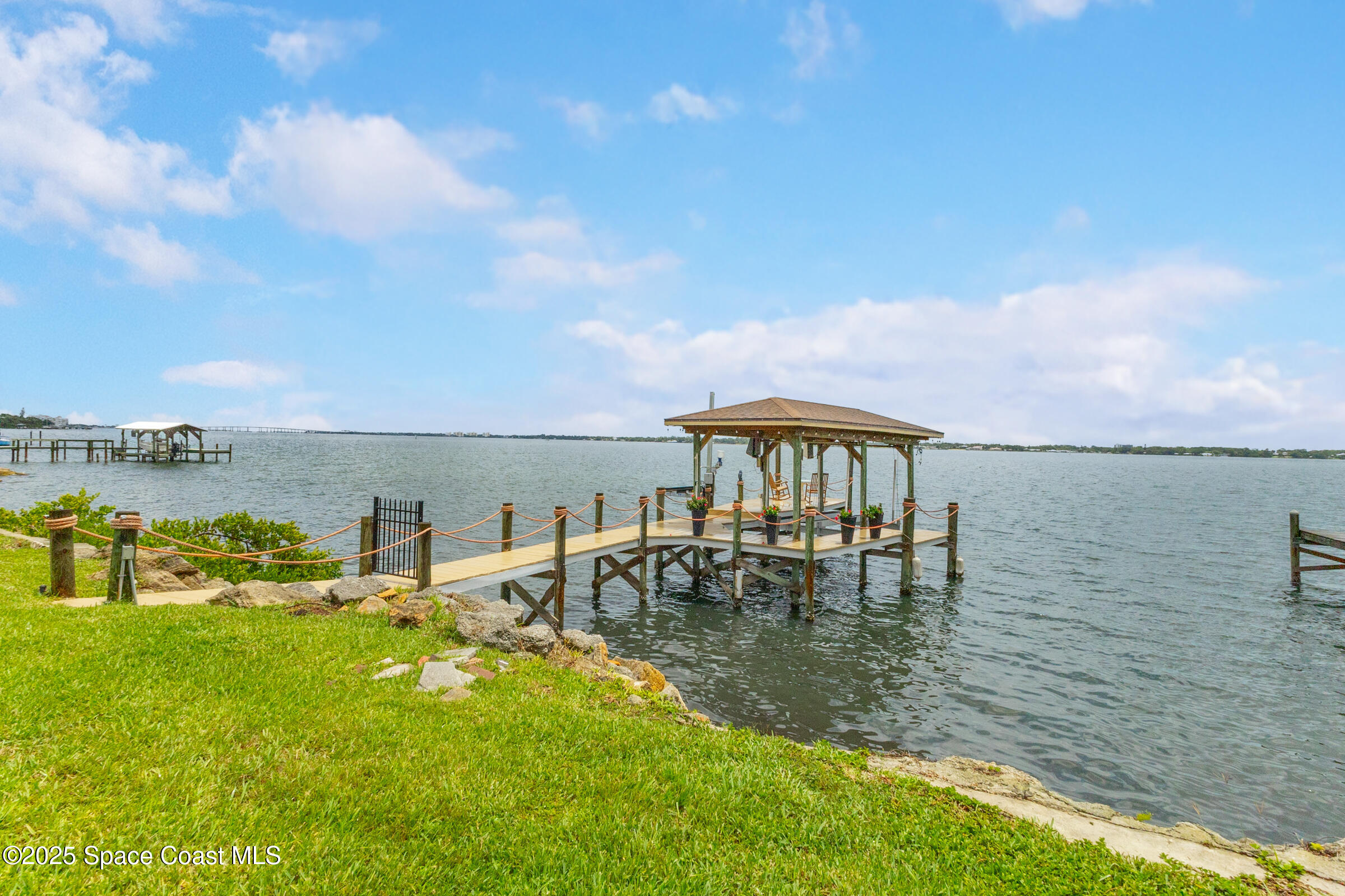 1307 Rockledge Drive Rockledge, FL 32955 - Photo 64 of 75 a view of a lake with houses in the back