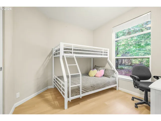 a bedroom with furniture and a window