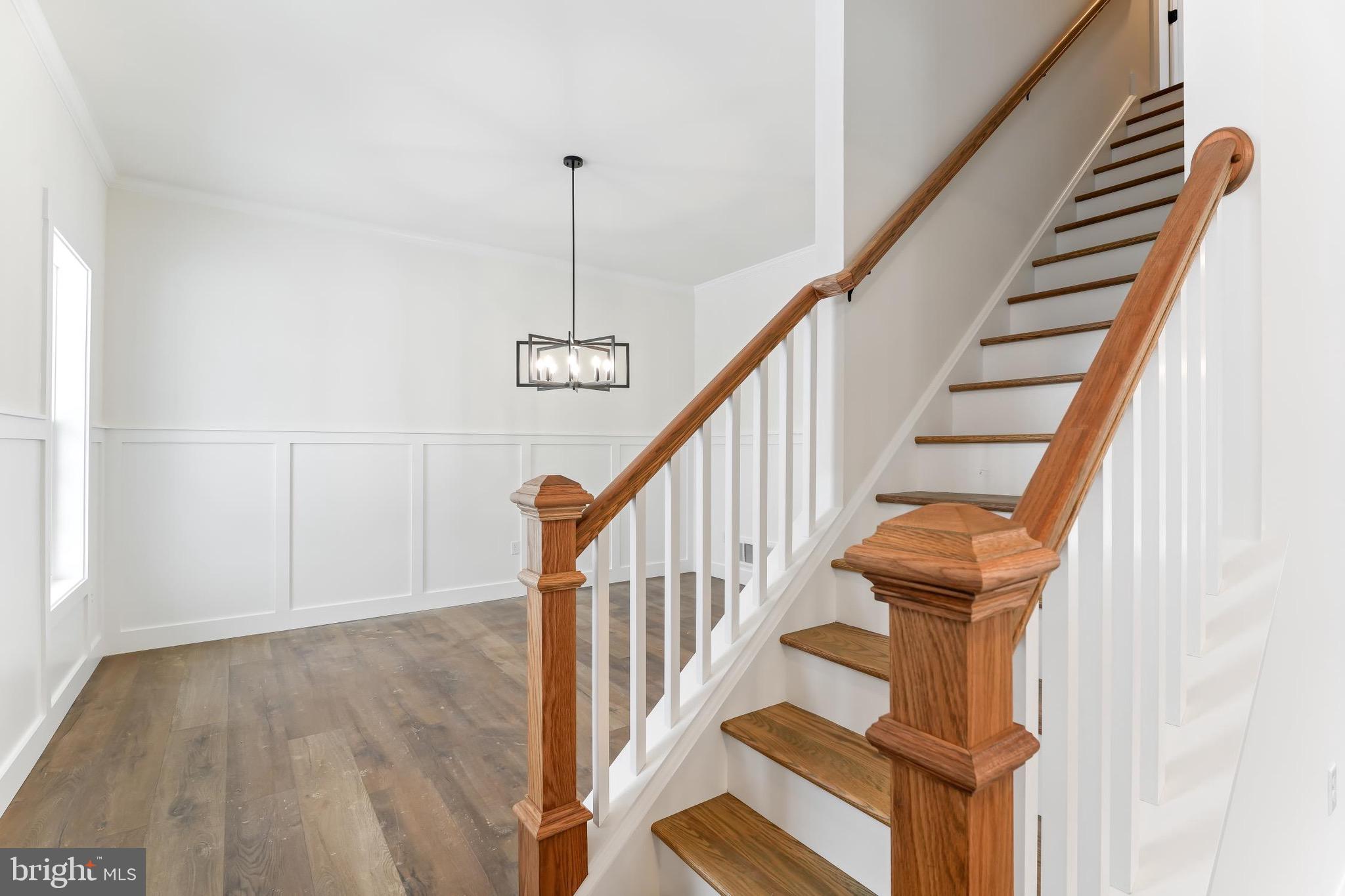 179 Ellicott Road Avondale, PA 19311 - Photo 12 of 56 a view of staircase with wooden floor and white walls