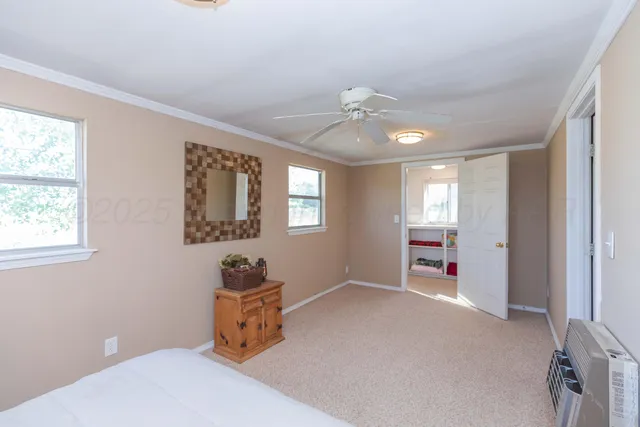a big room with windows and closet