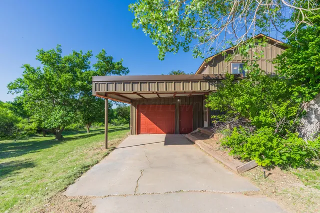 front view of a house with a garden