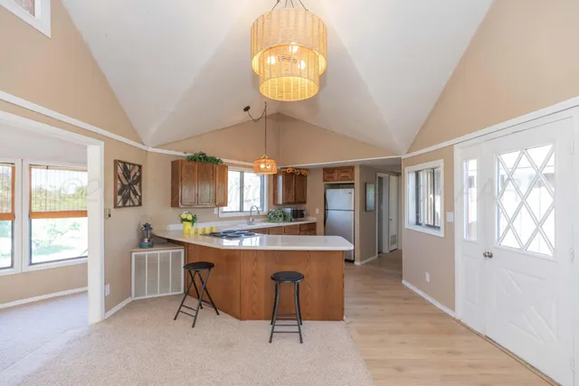 a view of a kitchen and microwave