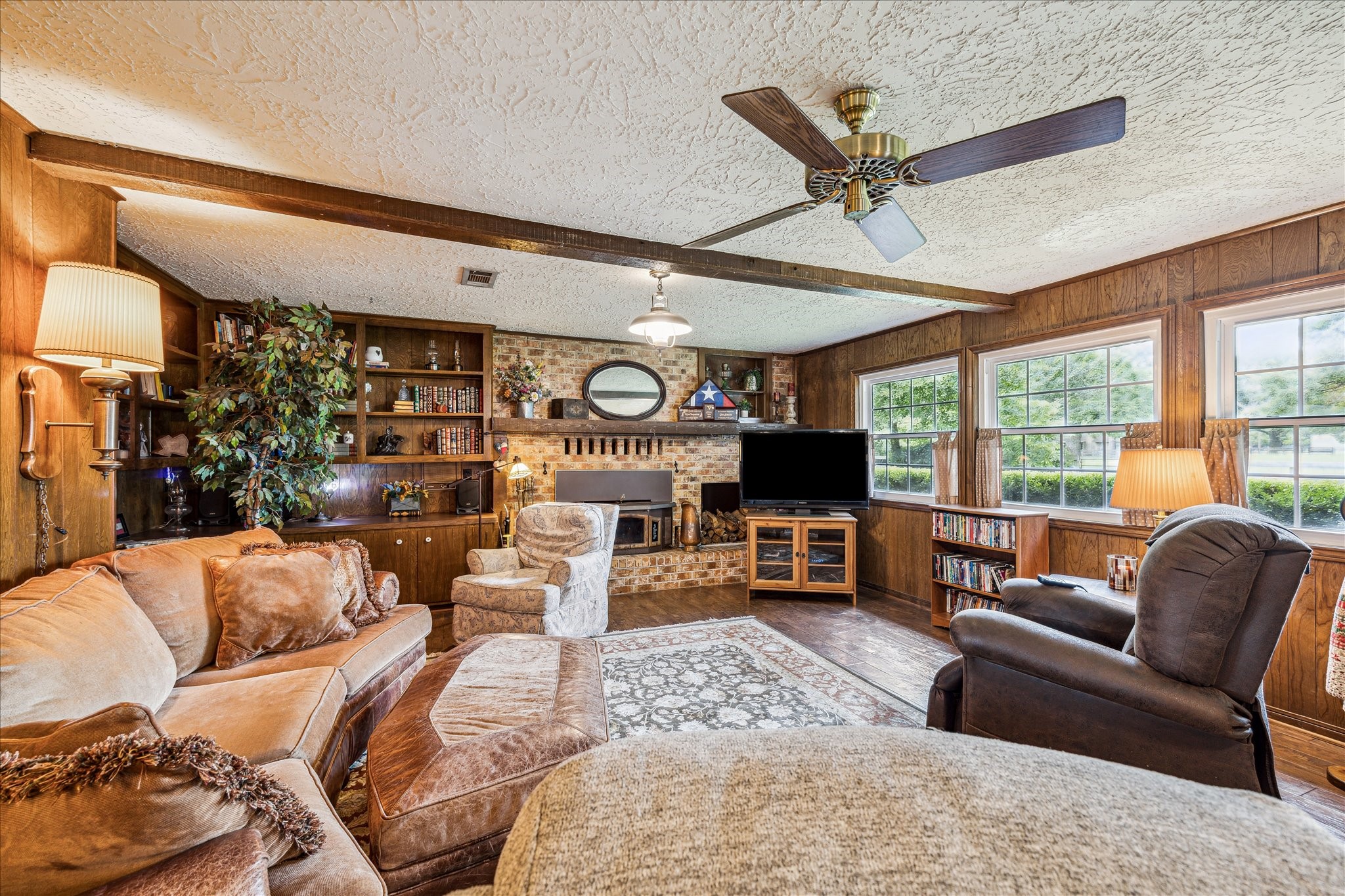 17814 Seidel Cemetary Road Tomball, TX 77377 - Photo 12 of 30 a living room with furniture ceiling fan and a large window