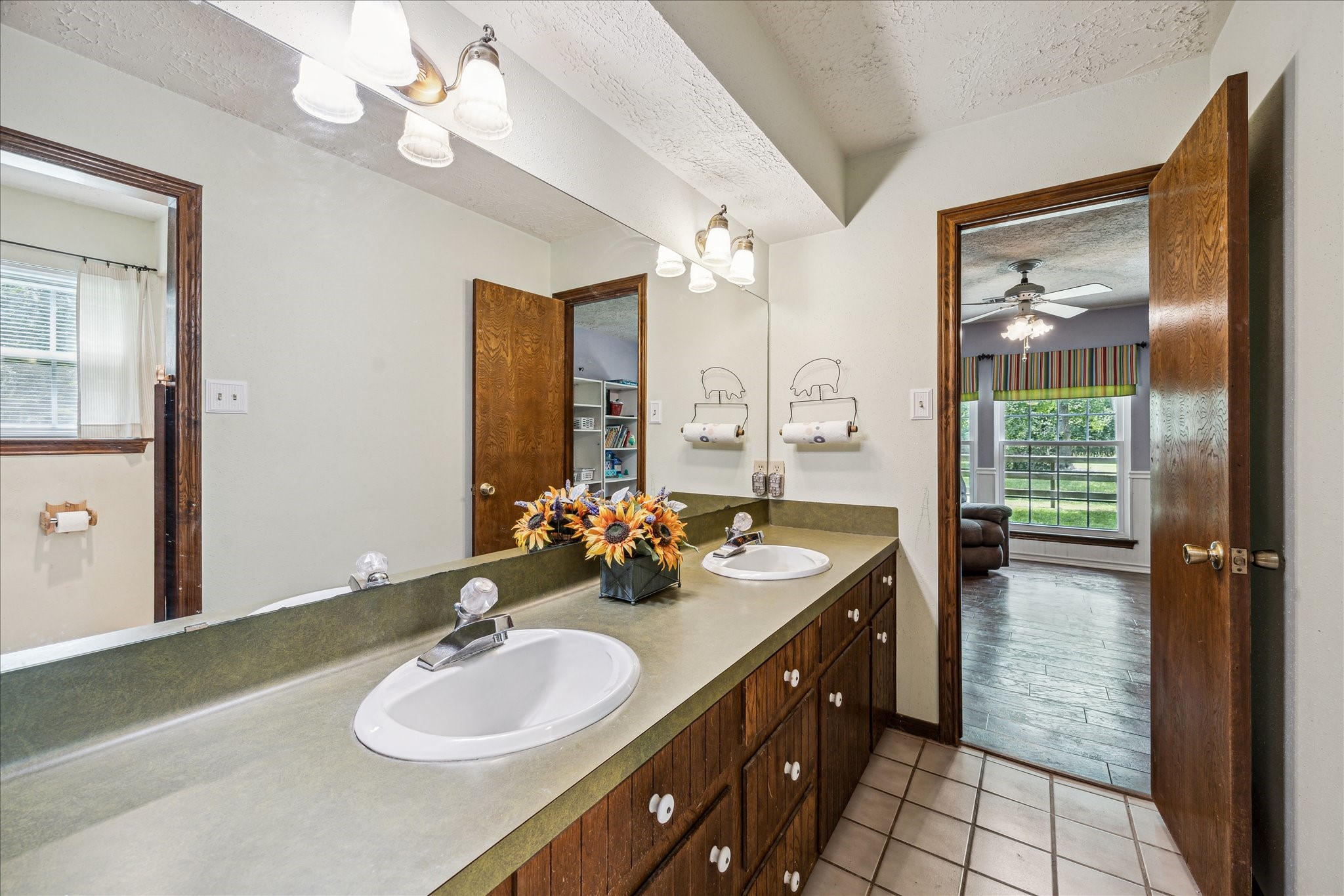 17814 Seidel Cemetary Road Tomball, TX 77377 - Photo 22 of 30 a bathroom with a granite countertop sink a large mirror and a shower