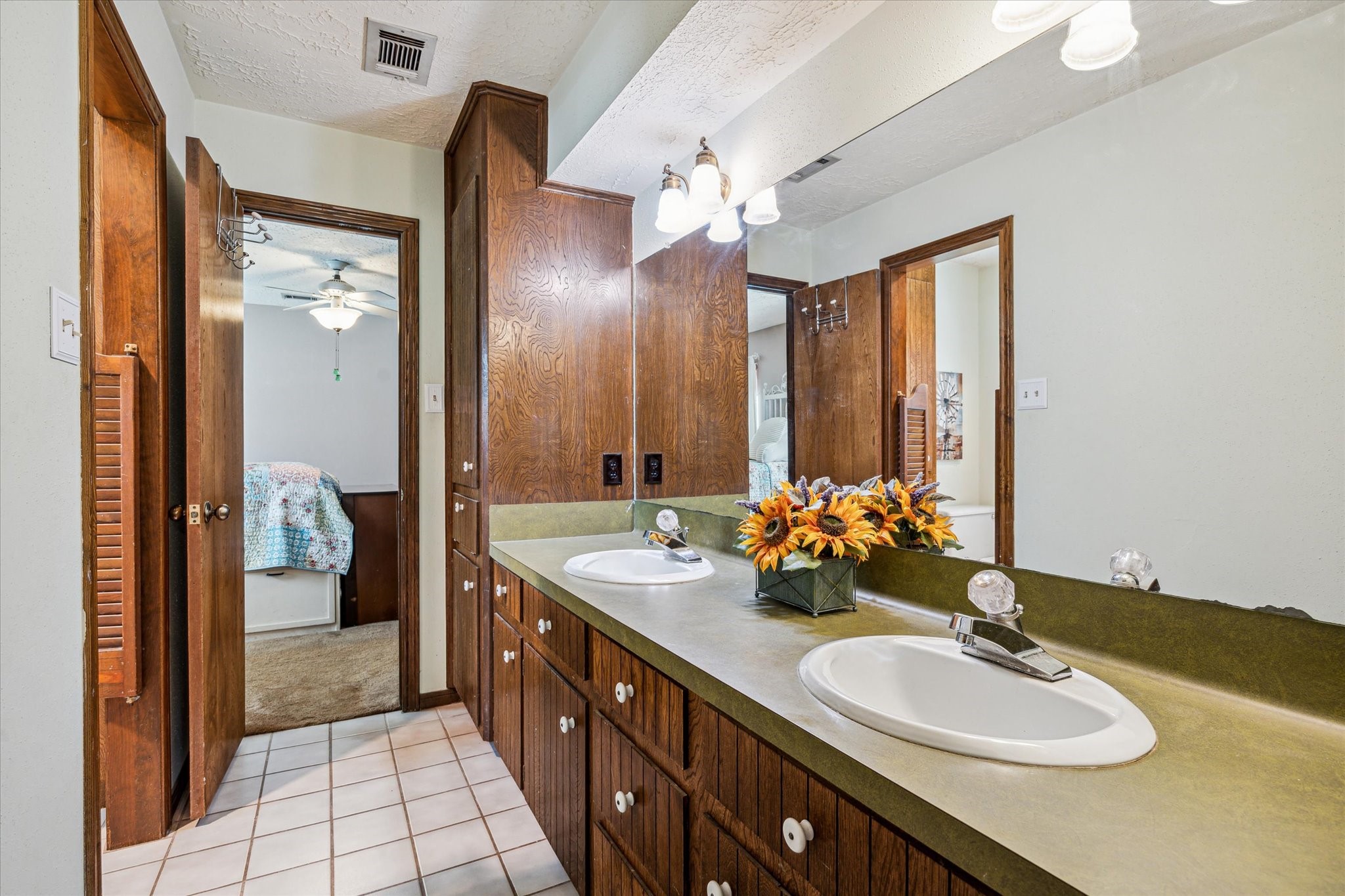 17814 Seidel Cemetary Road Tomball, TX 77377 - Photo 23 of 30 a spacious bathroom with a double vanity sink and a mirror