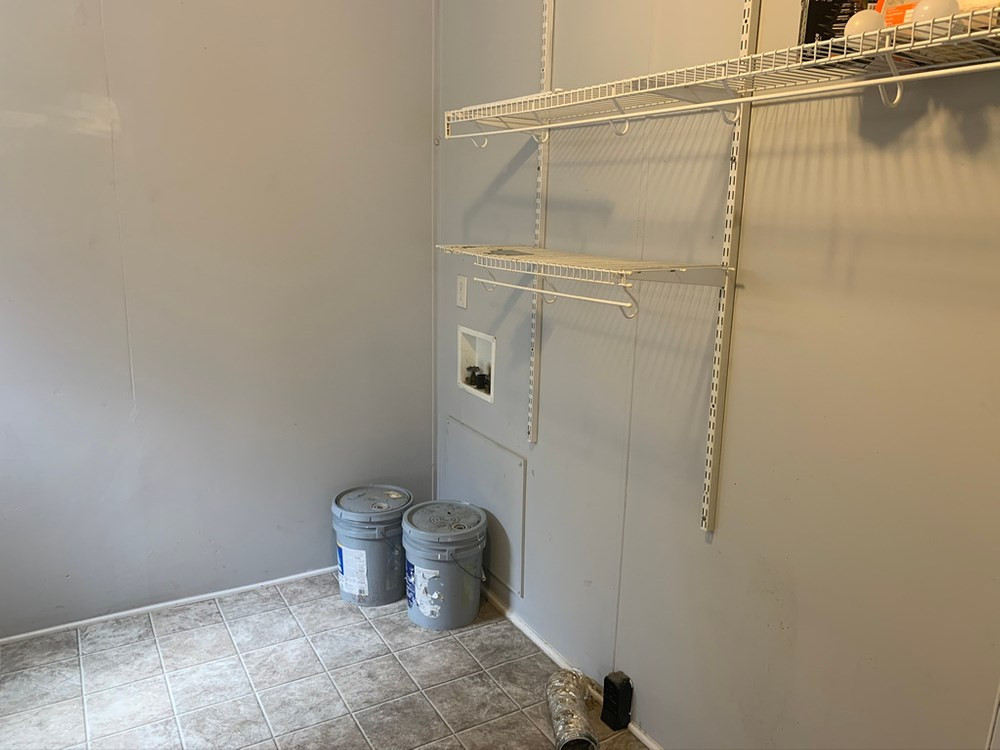 8834 Creek Road Willow Spring, NC 27592 - Photo 16 of 20 Wash/Dryer room off of kitchen near rear exit