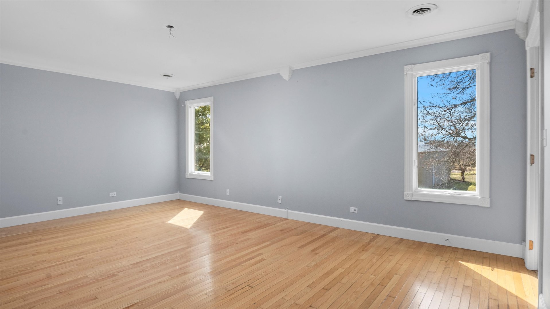 Undisclosed Address Elwood, IL 60421 - Photo 21 of 41 a view of an empty room with wooden floor and a window