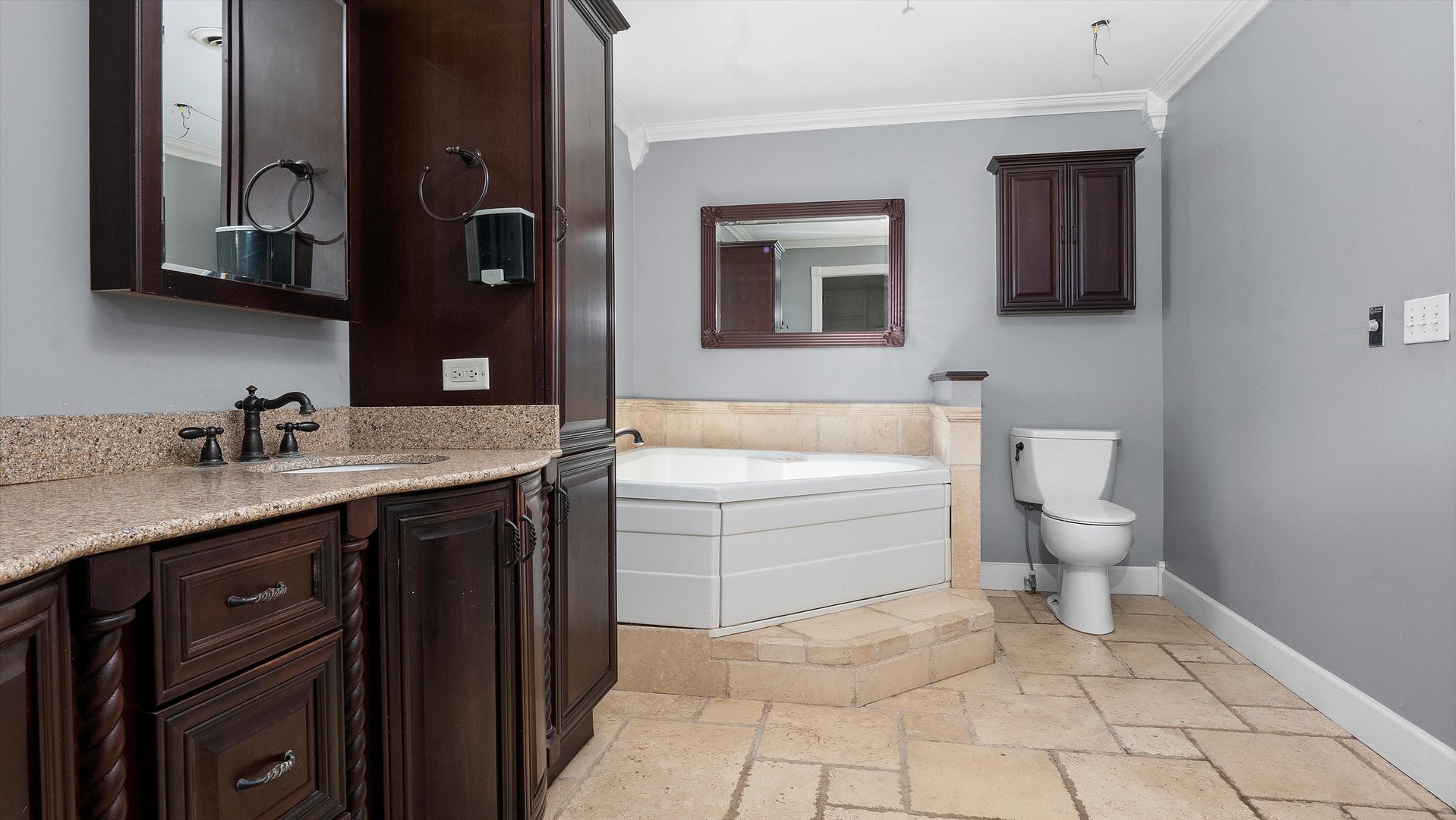 Undisclosed Address Elwood, IL 60421 - Photo 33 of 41 a spacious bathroom with a granite countertop sink a toilet and mirror