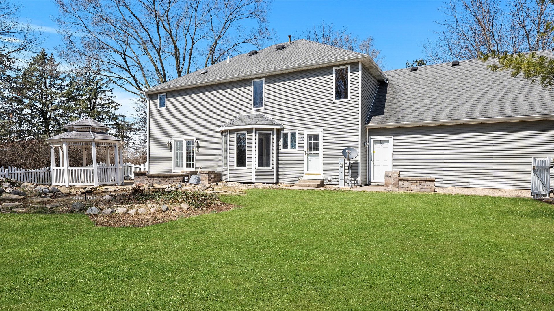 Undisclosed Address Elwood, IL 60421 - Photo 40 of 41 a front view of a house with a yard