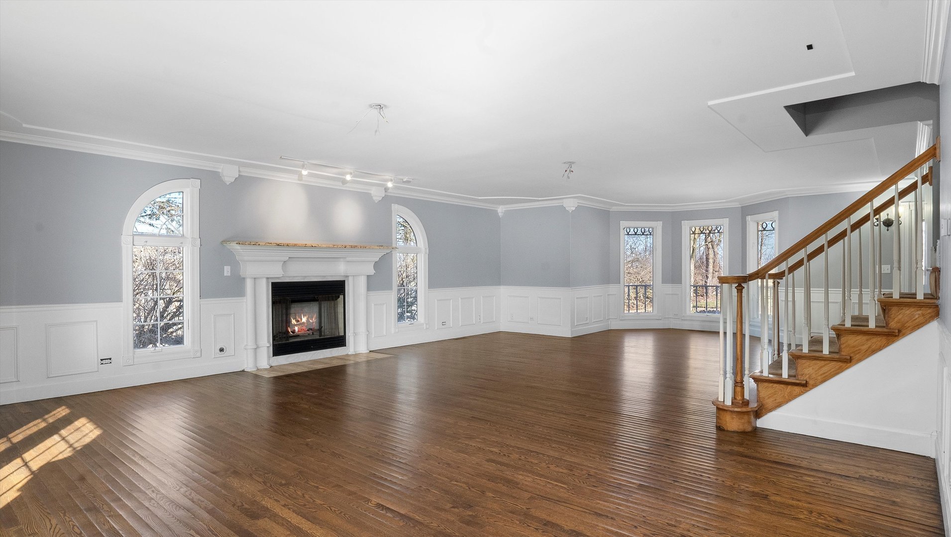Undisclosed Address Elwood, IL 60421 - Photo 8 of 41 a view of an empty room with wooden floor and fireplace