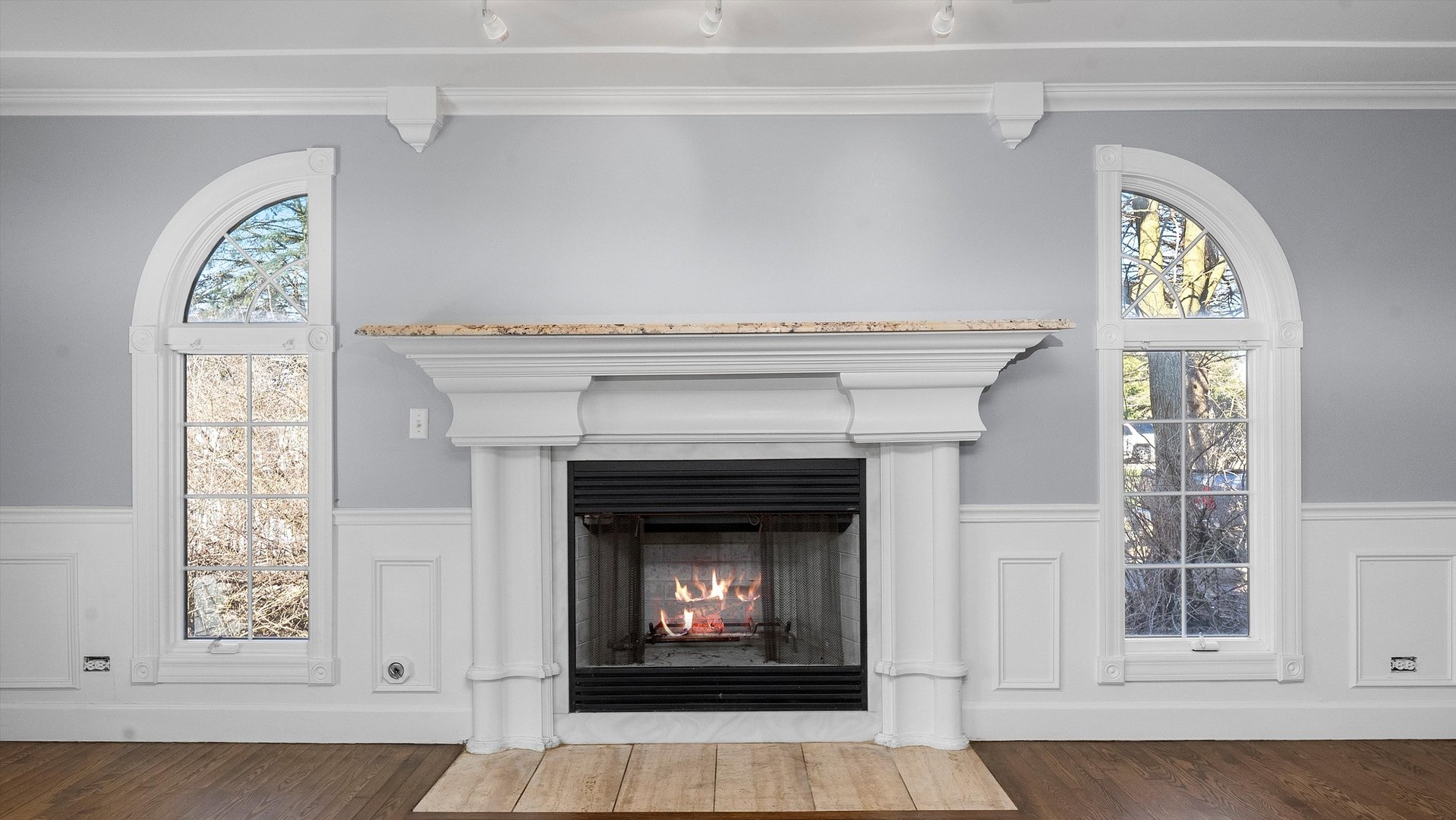 Undisclosed Address Elwood, IL 60421 - Photo 9 of 41 a living room with a fireplace and a window