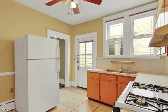a kitchen with stainless steel appliances a refrigerator and a sink