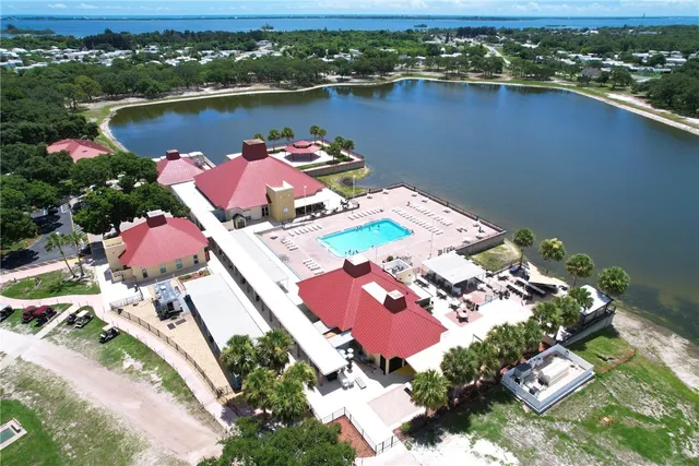 an aerial view of a house with a lake view