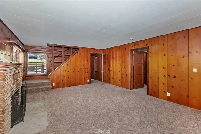 a view of an empty room with stairs