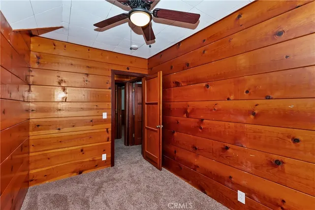 a view of an empty room and a window