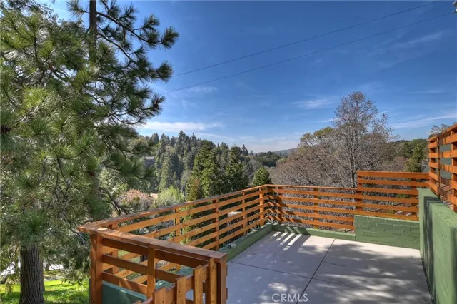 a view of a roof deck with wooden fence