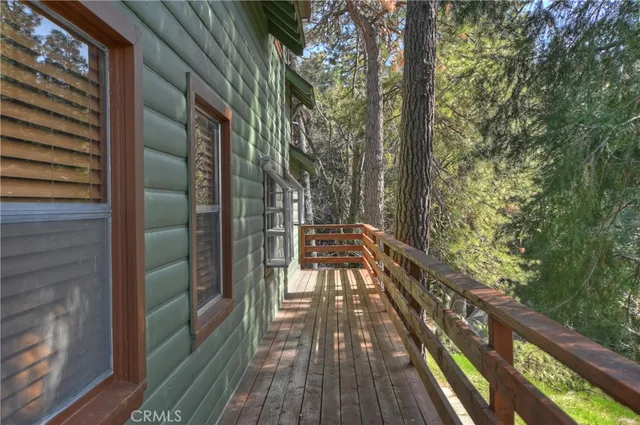 a view of balcony with wooden floor