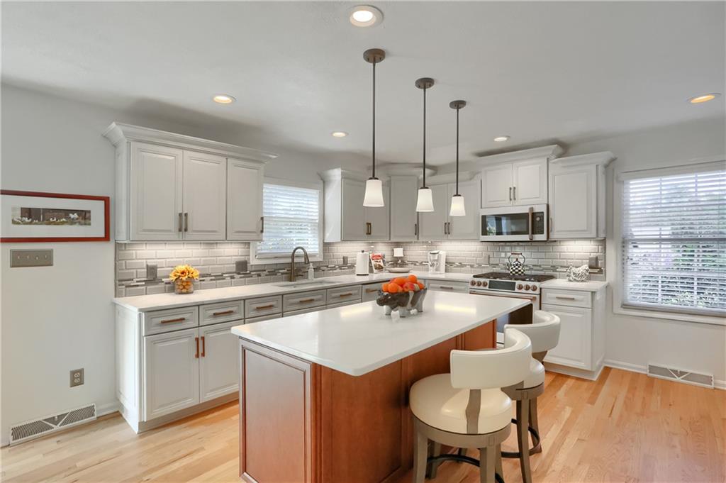 4201 Battle Ridge Road McDonald, PA 15057 - Photo 15 of 50 a kitchen with a sink a stove a refrigerator and wooden floor