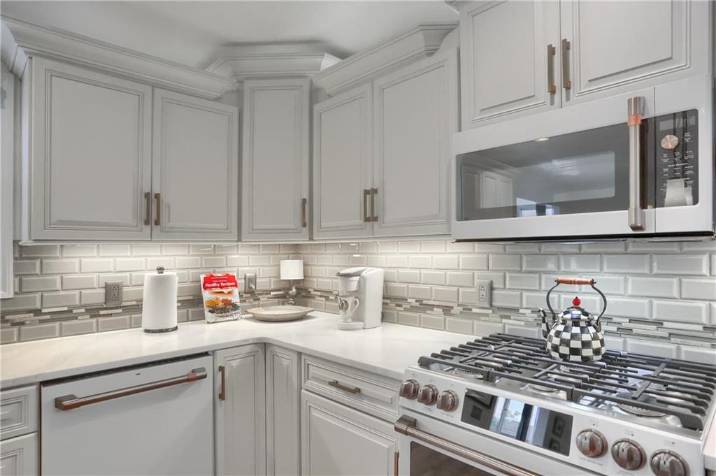 4201 Battle Ridge Road McDonald, PA 15057 - Photo 18 of 50 a kitchen with stainless steel appliances granite countertop white cabinets a stove a sink and dishwasher