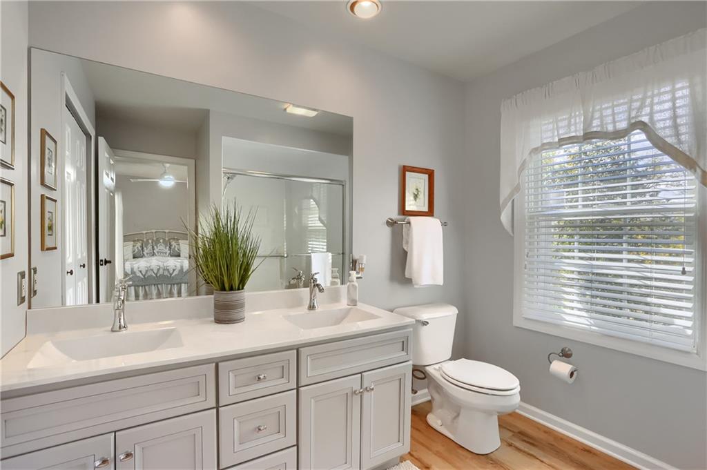 4201 Battle Ridge Road McDonald, PA 15057 - Photo 32 of 50 a bathroom with a double vanity sink toilet and a mirror