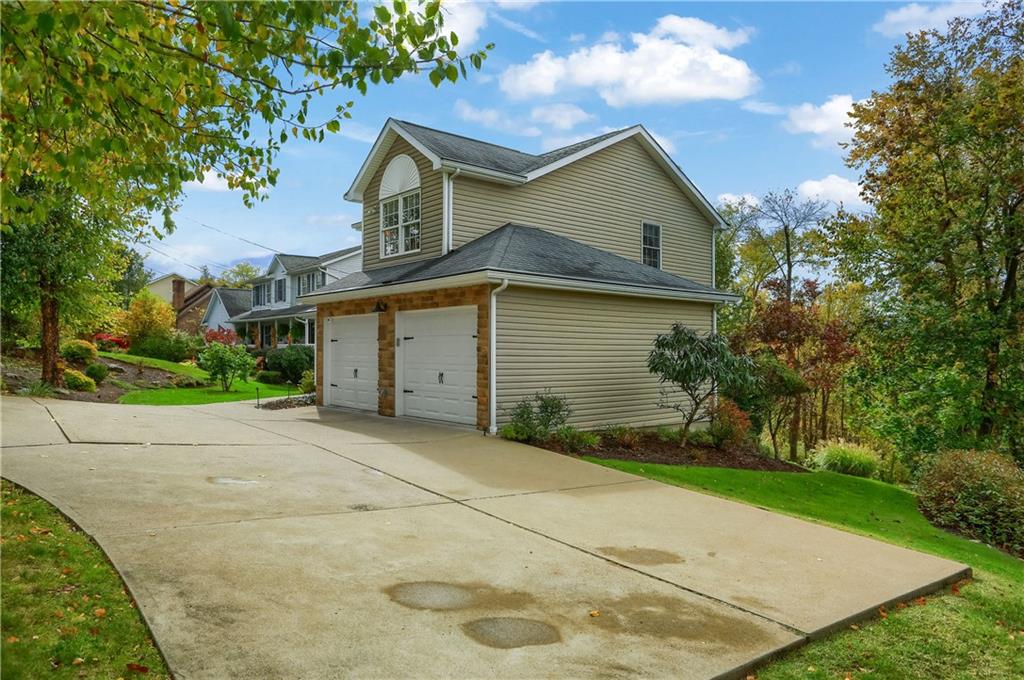 4201 Battle Ridge Road McDonald, PA 15057 - Photo 4 of 50 a front view of a house with a yard and garage