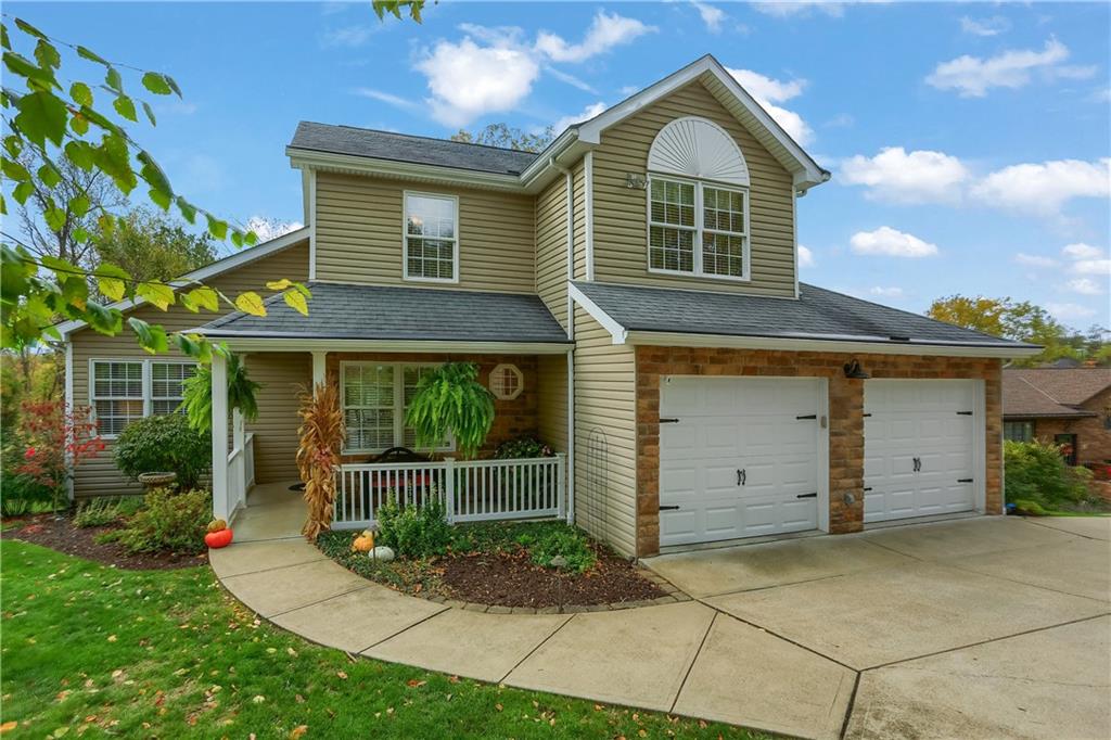 4201 Battle Ridge Road McDonald, PA 15057 - Photo 50 of 50 a front view of a house with a garden and plants