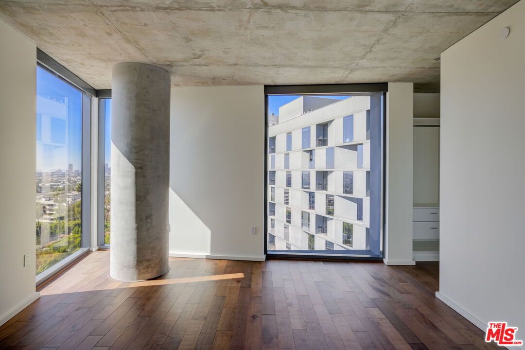 8500 West Sunset, Unit E711 Los Angeles, CA 90069 - Photo 8 of 10 a view of an entryway with wooden floor