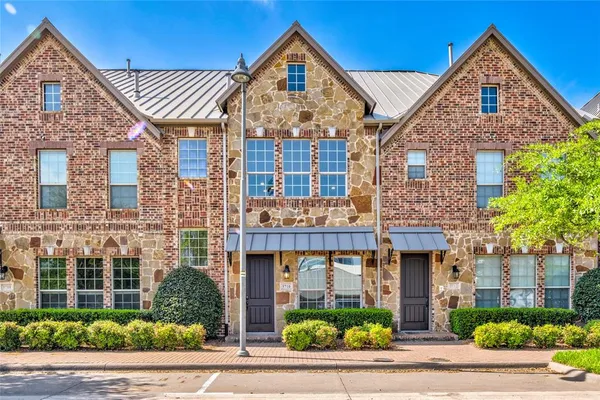 front view of a building with a garden