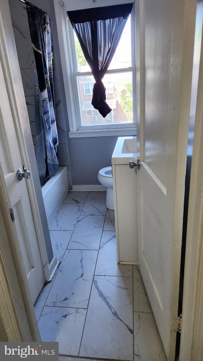 1024 Wicklow Road Baltimore, MD 21229 - Photo 26 of 44 a view of bathroom with a toilet and a shower