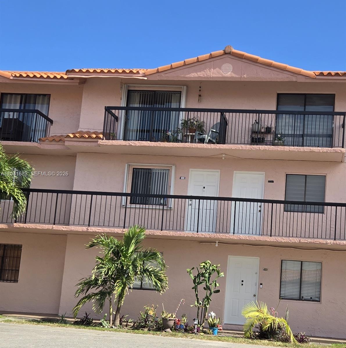 2174 West 60th Street, Unit 17205 Hialeah, FL 33016 - Photo 1 of 11 a view of a house with a balcony