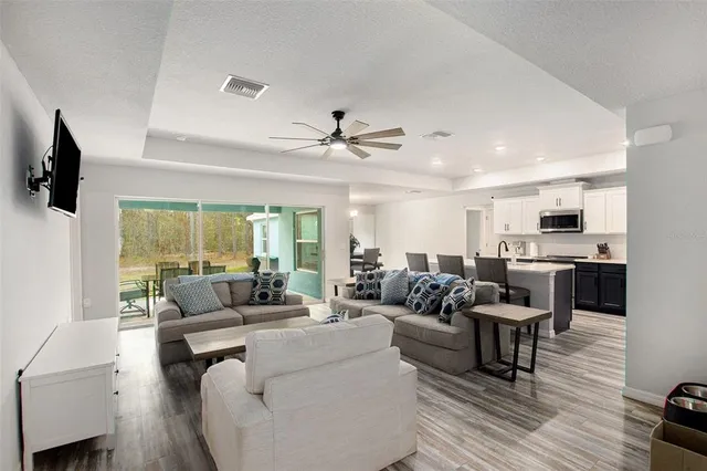a living room with furniture fireplace and flat screen tv
