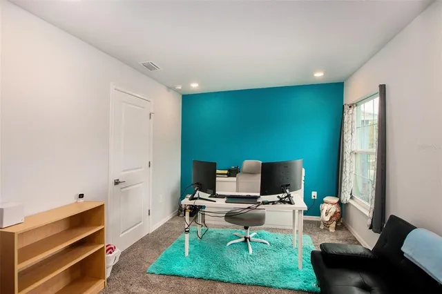 a workspace with furniture and a window