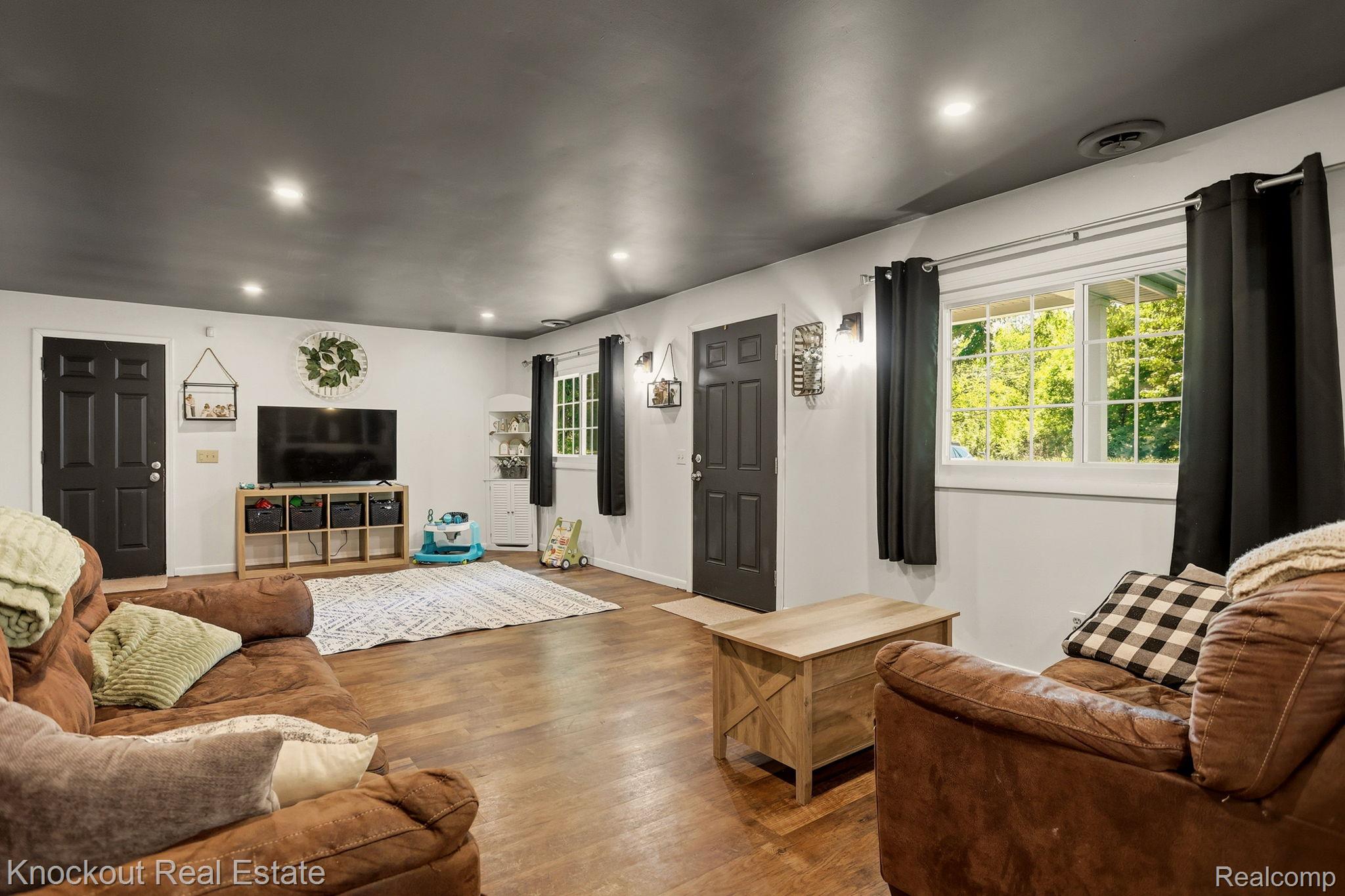 8845 Ormes Road Vassar, MI 48768 - Photo 6 of 35 Living space featuring wood-finish flooring and recessed lighting
