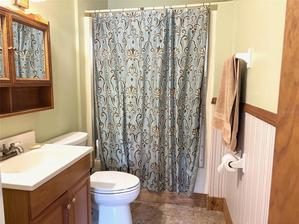 333 Riviera Drive Crescent City, FL 32112 - Photo 11 of 22 a bathroom with a sink toilet and shower